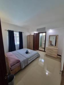 Postel nebo postele na pokoji v ubytování Villa Palmira 6 suites avec piscine 5 min à pied de la plage Pereybere