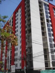 a red and white building with a red at Habitación Privada in Ibagué
