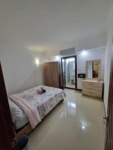 Postel nebo postele na pokoji v ubytování Villa Palmira 6 suites avec piscine 5 min à pied de la plage Pereybere