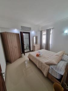 Postel nebo postele na pokoji v ubytování Villa Palmira 6 suites avec piscine 5 min à pied de la plage Pereybere
