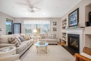 a living room with a couch and a fireplace at Bear Trap Dunes - 60E October Glory in Ocean View