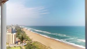 a view of a beach with the ocean at Shangri-La Penthouse View in Kingsburgh