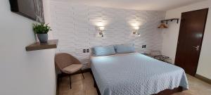 Palmareca Inn-Suites-Studio tesisinde bir odada yatak veya yataklar