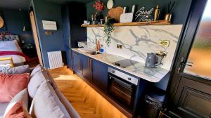 a kitchen with a counter and a sink and a couch at TT Lodges in Stockton-on-Tees
