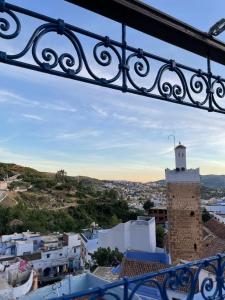 a view of a city from a balcony at Coco Chawen in Chefchaouen