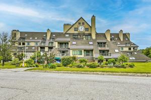 a large building with a clock on the top of it at Killington Vacation Gem Walk to Ski Lifts! in Killington