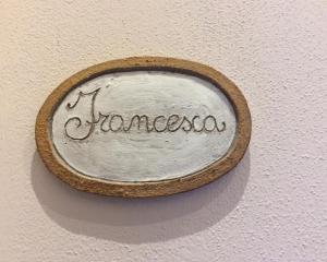 a sign on a wall that says jumanoscoxin at Il Portico in Monterosso al Mare