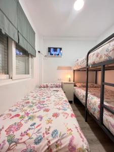A bed or beds in a room at Nuestro Rinconcito del Soho