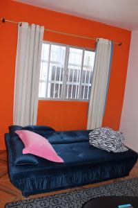 Ένα ή περισσότερα κρεβάτια σε δωμάτιο στο Casa de praia da Kenna, centro