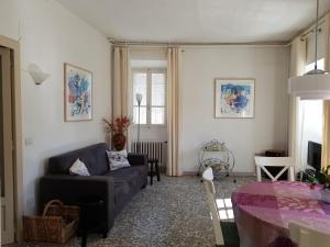 a living room with a couch and a table at Camelia Casa Vacanze in Palazzo Canavese