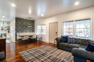 a living room with a couch and a table at Pruett Place Downtown Home in Knoxville