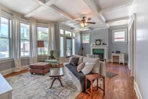 a living room with a couch and a fireplace at Elegant Colonial with Lovely Details and Character in Memphis