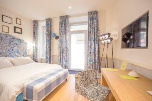 Postel nebo postele na pokoji v ubytování Cinque Rooms