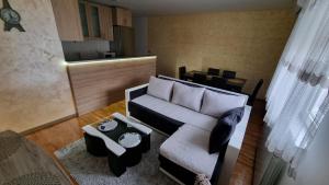 a living room with a couch and a table at Raven2 in Železnik