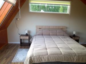 Ein Bett oder Betten in einem Zimmer der Unterkunft EL RINCON DE LÚ