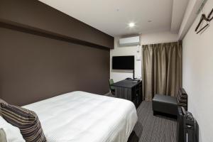 TV a/nebo společenská místnost v ubytování Hotel Reference Tenjin III