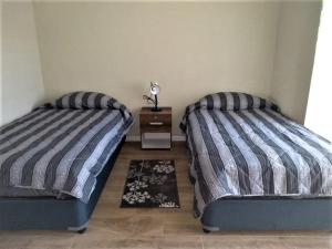 Cama o camas de una habitación en EL RINCON DE LÚ