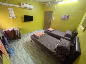 TV a/nebo společenská místnost v ubytování Ikhlas Roomstay