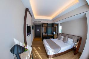 Sayarsan Hotel Yangon客房内的一张或多张床位
