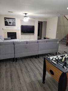 a living room with a couch and a chess board at 5 bed 3.5 baths in Las Vegas