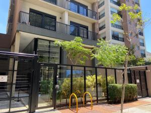 an office building with a revolving door in front of it at 67 New studio in great location! Fast WI-FI, balcony in Sao Paulo