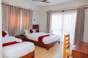 Postel nebo postele na pokoji v ubytování Hotel Sandalwood