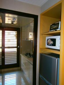 Kuchyň nebo kuchyňský kout v ubytování AJ Residence 安捷國際公寓酒店