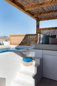 a pool on the roof of a house at Phos Milos in Pollonia