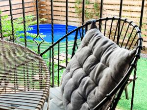 a bench with a pillow on it in front of a playground at Crimson View in Moshav Ramot