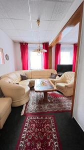 Posezení v ubytování Ferienwohnung NEUMANN a.d. Porzellan-Manufaktur + 2 fotografie