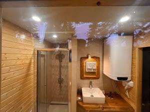 a bathroom with a sink and a shower at Boro Green Holiday Village in Borovets +90 photos