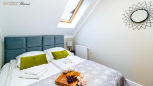 Łóżko lub łóżka w pokoju w obiekcie Wonder Home - Apartamenty położone blisko deptaka, licznych restauracji i sklepów