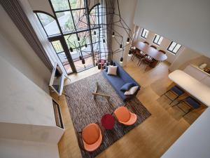 an overhead view of a living room with a blue couch at Hundert Hills in Jeju