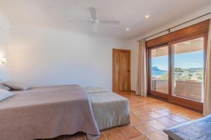 Posteľ alebo postele v izbe v ubytovaní Casa Once Moraira