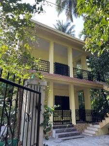 a house with a gate in front of it at Shobha Niwas in Nandgaon