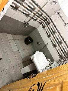 an overhead view of a bathroom with a toilet at Shelton Royal Hotel in Multan