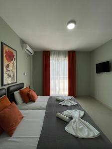 Ένα ή περισσότερα κρεβάτια σε δωμάτιο στο ApartHotel Solaris