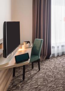 TV a/nebo společenská místnost v ubytování Park Inn by Radisson Neumarkt