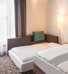 Postel nebo postele na pokoji v ubytování Park Inn by Radisson Neumarkt