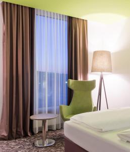 Postel nebo postele na pokoji v ubytování Park Inn by Radisson Neumarkt