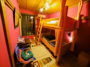 Giường trong phòng chung tại Guest House Tokiwa