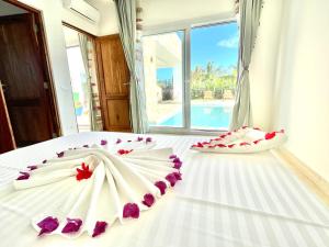 Postel nebo postele na pokoji v ubytování Manami Villa with Private Pool ZanzibarHouses + 11 fotografií