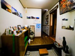 a home office with a desk and a room at Guest House Tokiwa in Fujinomiya