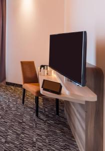 TV a/nebo společenská místnost v ubytování Park Inn by Radisson Neumarkt