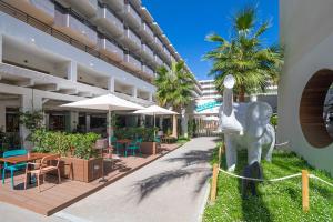 a statue of an elephant in front of a building at INNSiDE by Meliá Alcudia in Port d'Alcudia