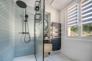 a bathroom with a shower with a glass shower at Belle maison pour 11 - Jardin - Détente in La Baule +26 photos