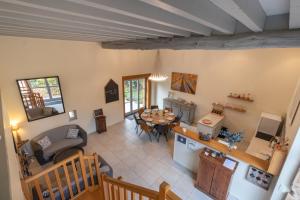 an aerial view of a living room and dining room at Gite Le Foineau - Maison avec Piscine in Bresse-sur-Grosne