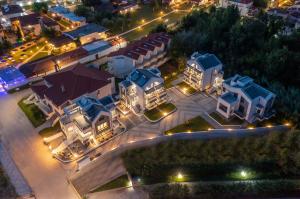 an overhead view of a city at night at The Black Pearl Villas in Kalamitsi