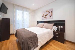 A bed or beds in a room at Villa Josechu en Candás
