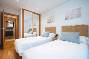 A bed or beds in a room at Villa Josechu en Candás